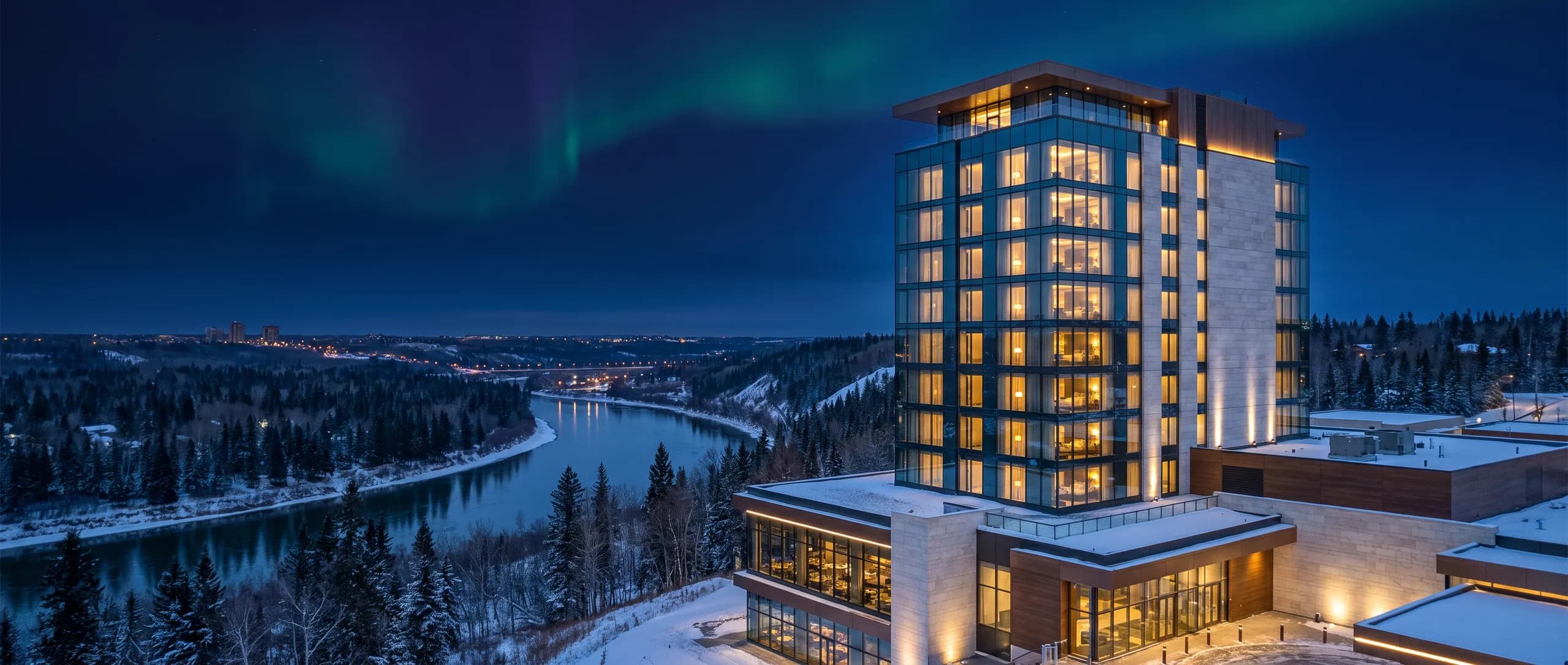 The Aurorahollow glass tower above the snowy river valley under a faint aurora